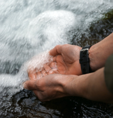Hands river water