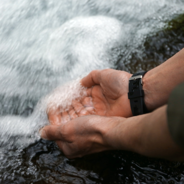 Hands river water